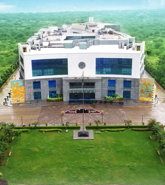 Aerial view of the Central Board of Secondary Education (CBSE) Headquarters building surrounded by greenery in New Delhi.